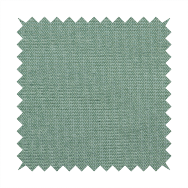 A textured sage or mint green fabric with a tight, uniform weave.