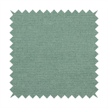A textured sage or mint green fabric with a tight, uniform weave.