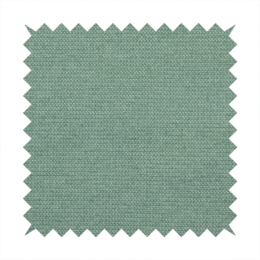 A textured sage or mint green fabric with a tight, uniform weave.