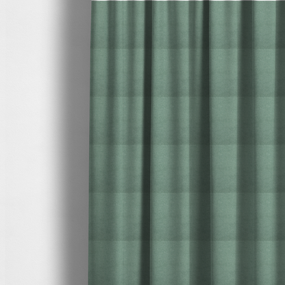 The fabric used to create these made-to-measure curtains is a textured sage or mint green fabric with a tight, uniform weave.