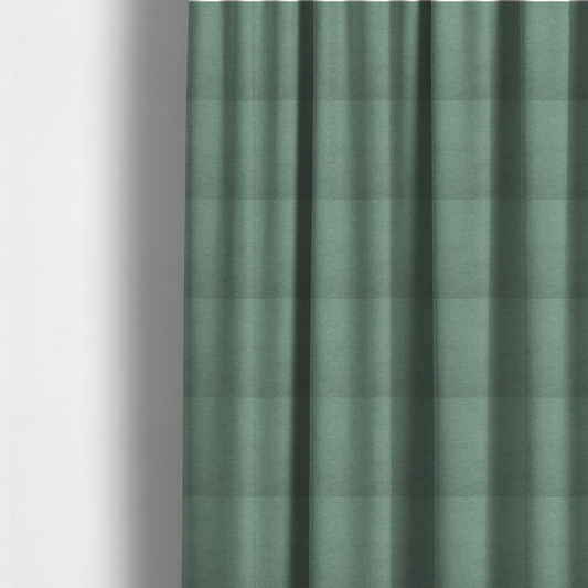 The fabric used to create these made-to-measure curtains is a textured sage or mint green fabric with a tight, uniform weave.