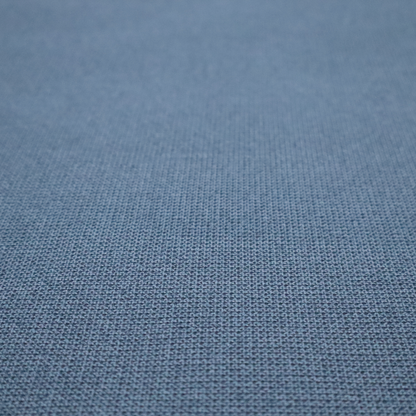 A textured denim blue fabric with a tight, uniform cross-weave pattern.