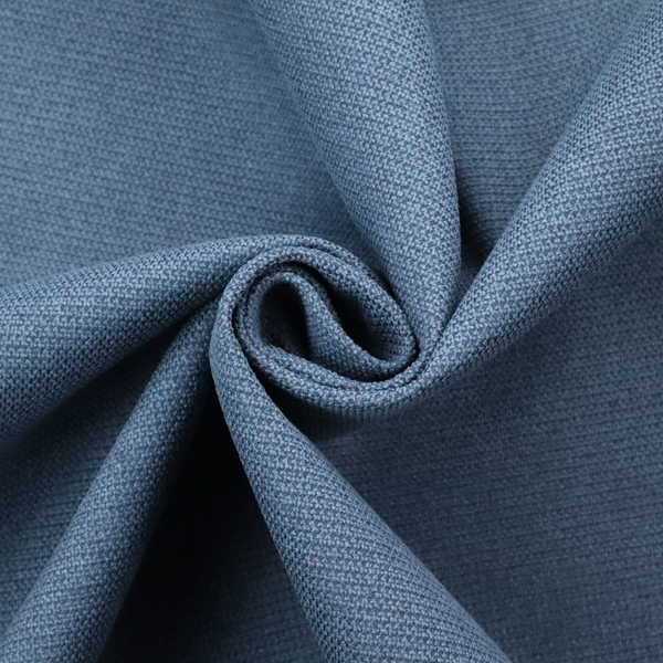 A textured denim blue fabric with a tight, uniform cross-weave pattern.