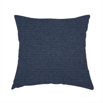 The fabric used to create this handmade cushion is a textured navy blue fabric with a tight, uniform cross-weave pattern.