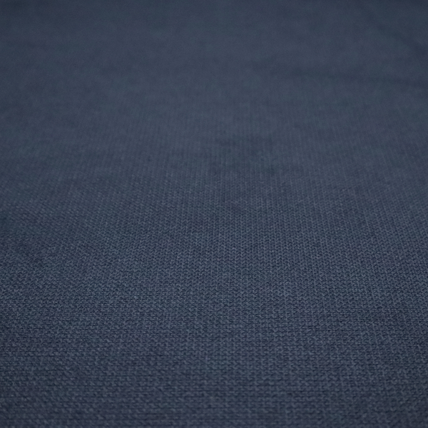 A textured navy blue fabric with a tight, uniform cross-weave pattern.