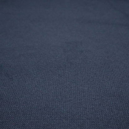 A textured navy blue fabric with a tight, uniform cross-weave pattern.