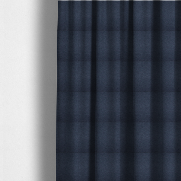 The fabric used to create these made-to-measure curtains is a textured navy blue fabric with a tight, uniform cross-weave pattern.