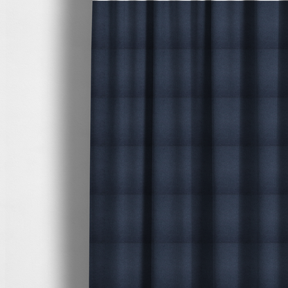 The fabric used to create these made-to-measure curtains is a textured navy blue fabric with a tight, uniform cross-weave pattern.