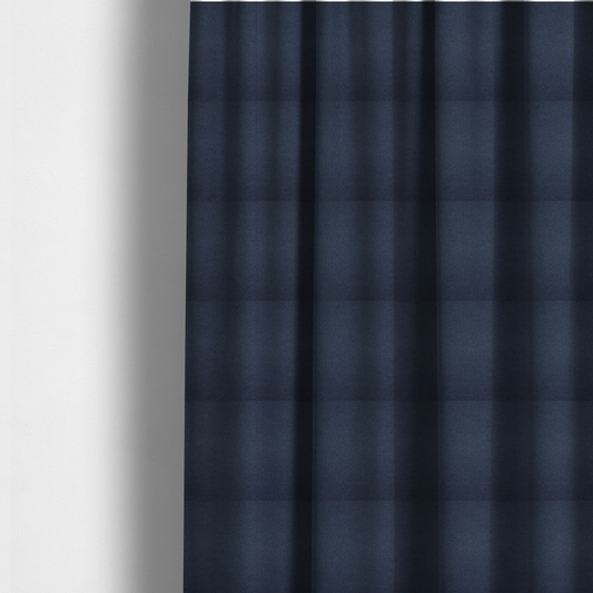 The fabric used to create these made-to-measure curtains is a textured navy blue fabric with a tight, uniform cross-weave pattern.