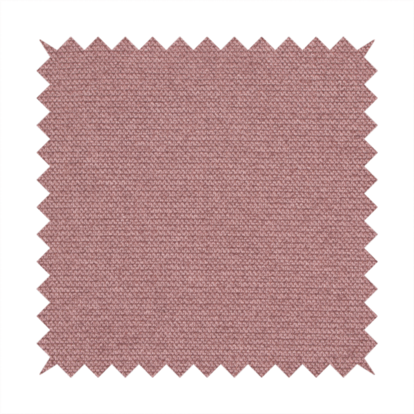 A textured dusty pink fabric with a tight, uniform weave.