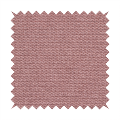 A textured dusty pink fabric with a tight, uniform weave.