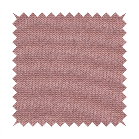 A textured dusty pink fabric with a tight, uniform weave.
