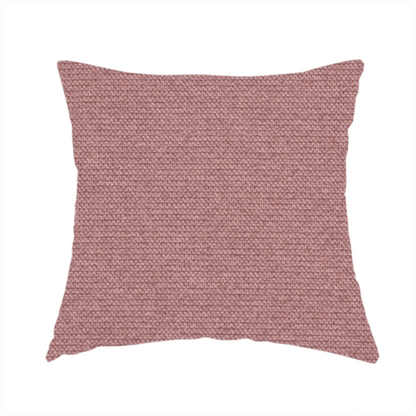 The fabric used to create this handmade cushion is a textured dusty pink fabric with a tight, uniform weave.