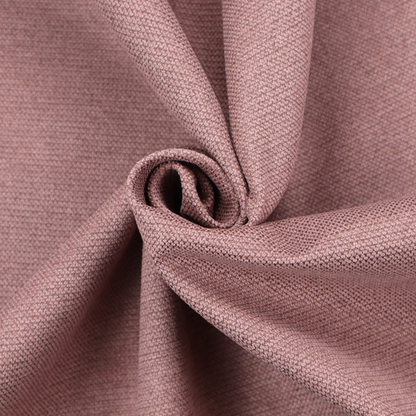A textured dusty pink fabric with a tight, uniform weave.