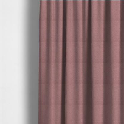 The fabric used to create these made-to-measure curtains is a textured dusty pink fabric with a tight, uniform weave.