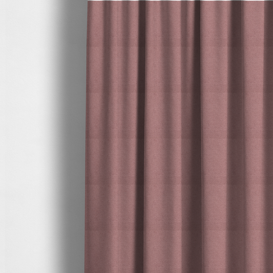 The fabric used to create these made-to-measure curtains is a textured dusty pink fabric with a tight, uniform weave.