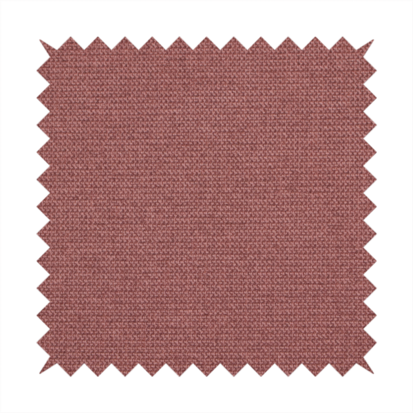 A textured terracotta pink fabric with a tight, uniform cross-weave.