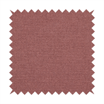 A textured terracotta pink fabric with a tight, uniform cross-weave.