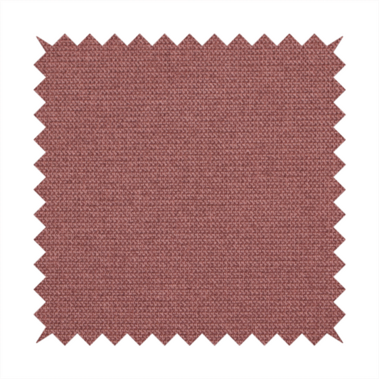 A textured terracotta pink fabric with a tight, uniform cross-weave.