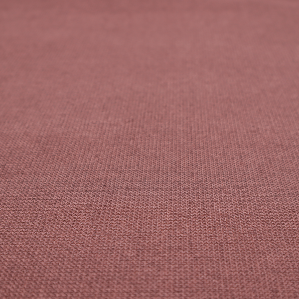 A textured terracotta pink fabric with a tight, uniform cross-weave.
