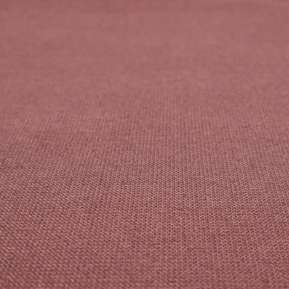 A textured terracotta pink fabric with a tight, uniform cross-weave.