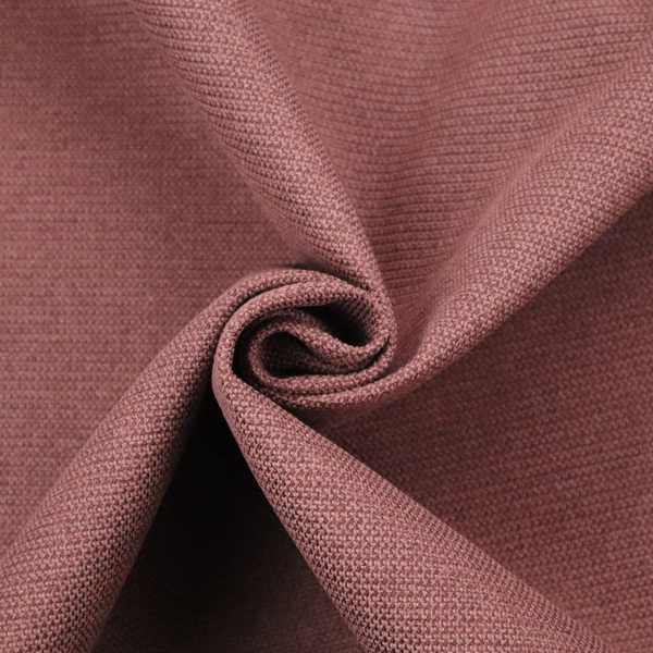 A textured terracotta pink fabric with a tight, uniform cross-weave.