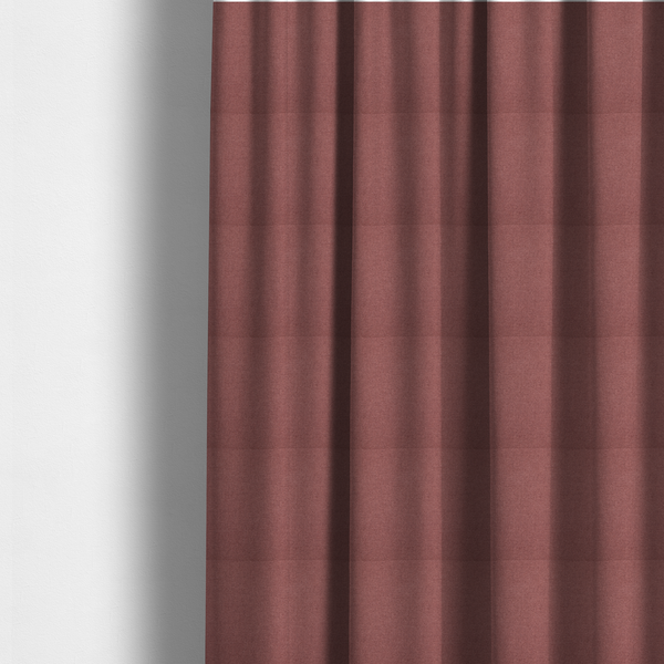 The fabric used to create these made-to-measure curtains is a textured terracotta pink fabric with a tight, uniform cross-weave.