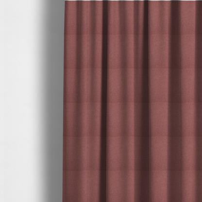 The fabric used to create these made-to-measure curtains is a textured terracotta pink fabric with a tight, uniform cross-weave.
