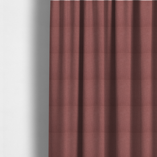 The fabric used to create these made-to-measure curtains is a textured terracotta pink fabric with a tight, uniform cross-weave.