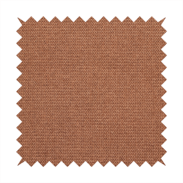 A textured terracotta orange fabric with a tight, uniform weave.