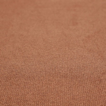 A textured terracotta orange fabric with a tight, uniform weave.