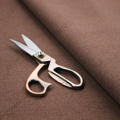A textured dark terracotta brown fabric with a tight, uniform cross-weave.
