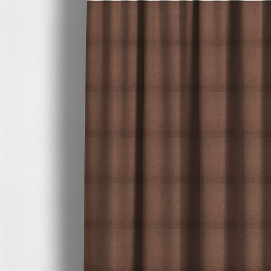 The fabric used to create these made-to-measure curtains is a textured dark terracotta brown fabric with a tight, uniform cross-weave.