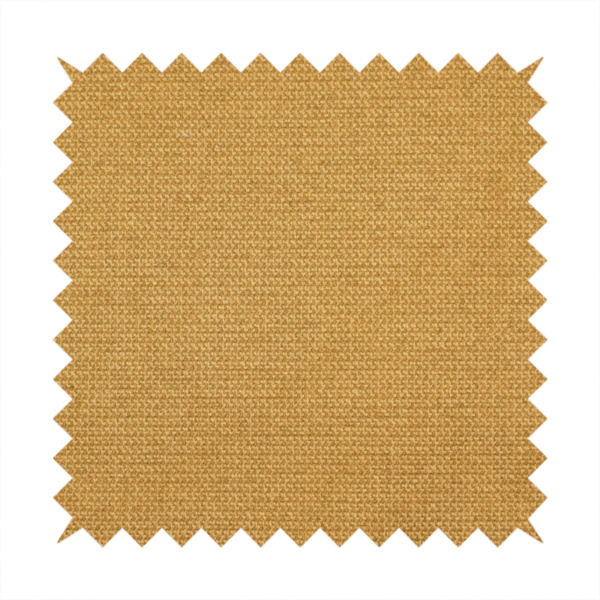 A textured mustard yellow fabric with a tight, uniform weave.