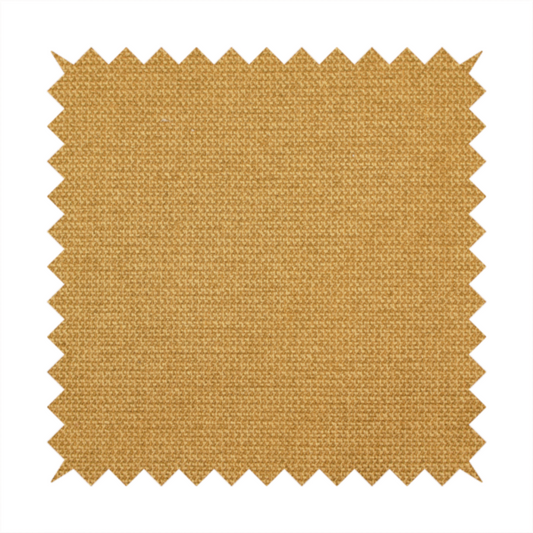 A textured mustard yellow fabric with a tight, uniform weave.