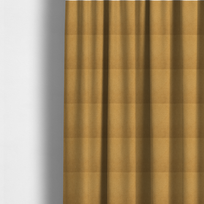 The fabric used to create these made-to-measure curtains is a textured mustard yellow fabric with a tight, uniform weave.