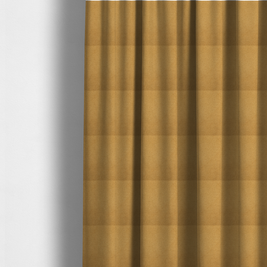 The fabric used to create these made-to-measure curtains is a textured mustard yellow fabric with a tight, uniform weave.