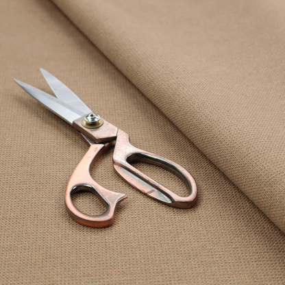 A textured beige fabric with a tight, uniform cross-weave.