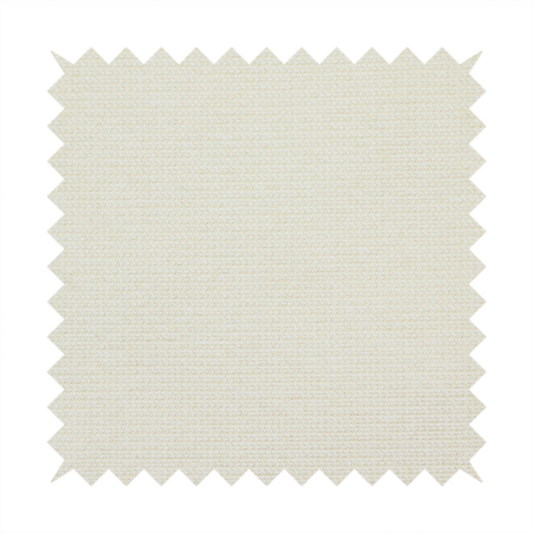 A textured cream-coloured fabric with a tight, uniform cross-weave.