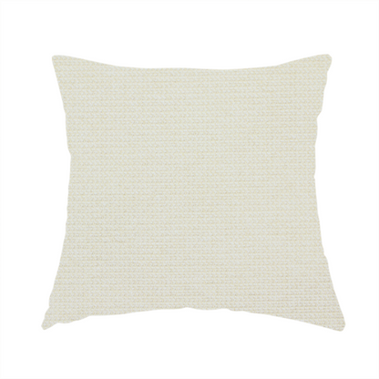 The fabric used to create this handmade cushion is a textured cream-coloured fabric with a tight, uniform cross-weave.