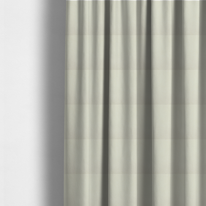 The fabric used to create these made-to-measure curtains is a textured cream-coloured fabric with a tight, uniform cross-weave.