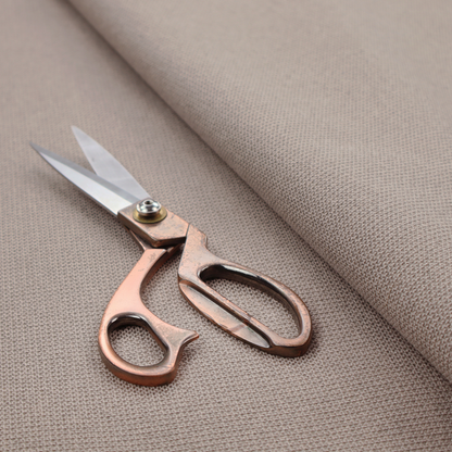A textured taupe fabric with a tight, uniform cross-weave.