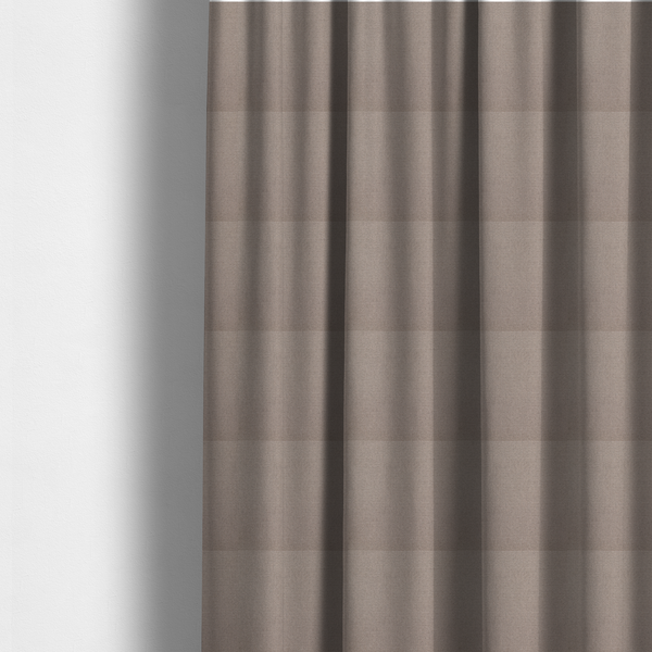The fabric used to create these made-to-measure curtains is a textured taupe fabric with a tight, uniform cross-weave.