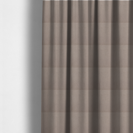 The fabric used to create these made-to-measure curtains is a textured taupe fabric with a tight, uniform cross-weave.