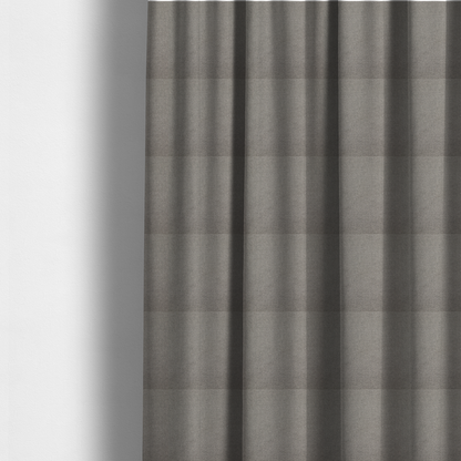 The fabric used to create these made-to-measure curtains is a textured light grey fabric with a tight, uniform cross-weave.
