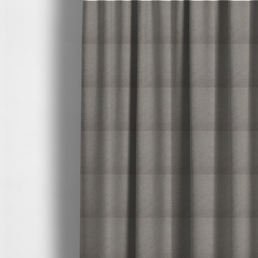 The fabric used to create these made-to-measure curtains is a textured light grey fabric with a tight, uniform cross-weave.