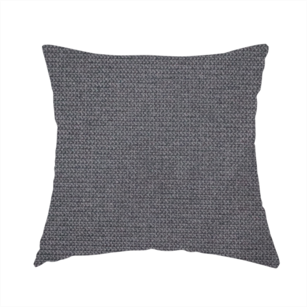 The fabric used to create this handmade cushion is a textured charcoal grey fabric with a tight, uniform cross-weave.