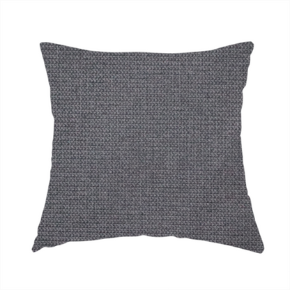 The fabric used to create this handmade cushion is a textured charcoal grey fabric with a tight, uniform cross-weave.