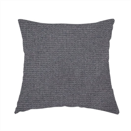 The fabric used to create this handmade cushion is a textured charcoal grey fabric with a tight, uniform cross-weave.
