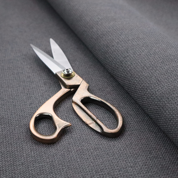A textured charcoal grey fabric with a tight, uniform cross-weave.